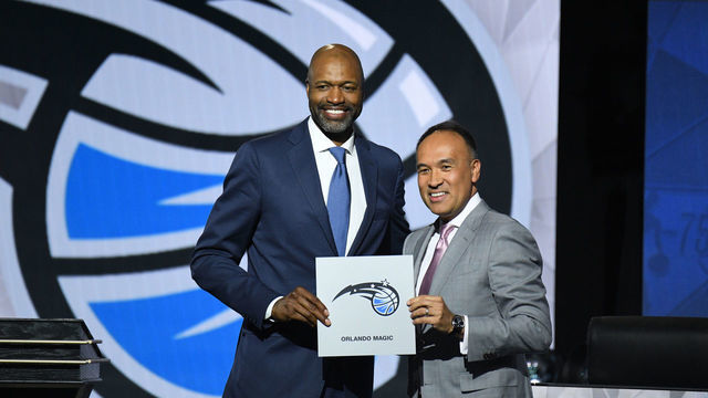 CHICAGO,IL - MAY 17: Deputy Commissioner of the NBA, Mark Tatum and Head Coach Jamahl Mosley of the Orland Magic hold up the card of the Orlando Magic after they get the 1st overall pick in the NBA Draftduring the 2022 NBA Draft Lottery at McCormick Place on May 17, 2022 in Chicago, Illinois. Mandatory Copyright Notice: Copyright 2022 NBAE