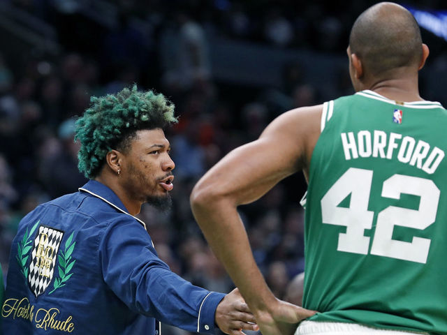 Boston - May 3: The Celtics Marcus Smart (left) has a hand for teammate Al Horford during a second quarter timeout. The Boston Celtics host the Milwaukee Bucks in Game 2 of the Eastern Conference semi-finals between the Celtics and Bucks on May 3, 2022 at TD Garden in Boston.