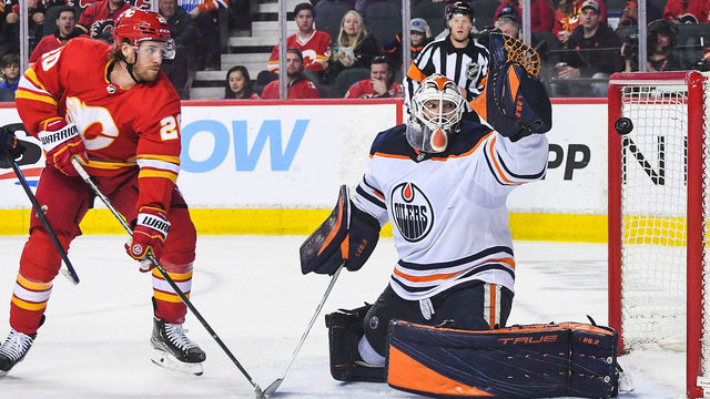 CALGARY, AB - MARCH 26: Mike Smith #41 of the Edmonton Oilers stops a shot from Blake Coleman #20 of the Calgary Flames during the third period an NHL game at Scotiabank Saddledome on March 26 2022 in Calgary, Alberta, Canada. The Calgary Flames defeated the Edmonton Oilers 9-5.