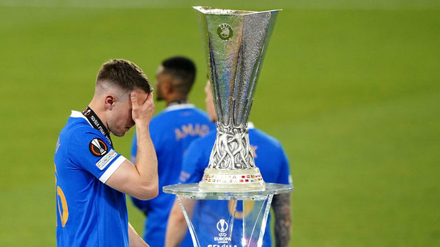 Rangers' Aaron Ramsey walks past the trophy following defeat in the UEFA Europa League Final at the Estadio Ramon Sanchez-Pizjuan, Seville. Picture date: Wednesday May 18, 2022.