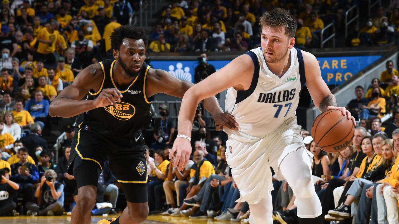 SAN FRANCISCO, CA - MAY 18: Andrew Wiggins #22 of the Golden State Warriors plays defense on Luka Doncic #77 of the Dallas Mavericks during Game 1 of the 2022 NBA Playoffs Western Conference Finals on May 18, 2022 at Chase Center in San Francisco, California. NOTE TO USER: User expressly acknowledges and agrees that, by downloading and or using this photograph, user is consenting to the terms and conditions of Getty Images License Agreement. Mandatory Copyright Notice: Copyright 2022 NBAE