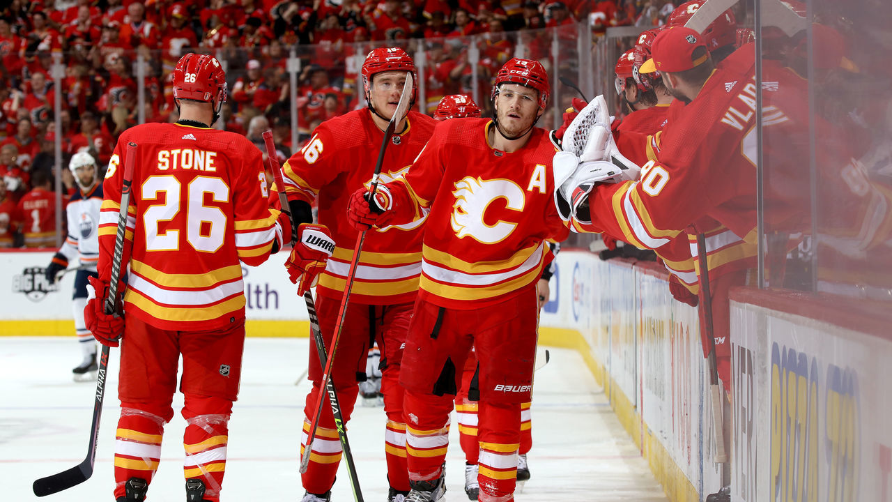 CALGARY, ALBERTA - MAY 18: Matthew Tkachuk #19 and teammates of the Calgary Flames celebrate a goal against the Edmonton Oilers in Game One of the Second Round of the 2022 Stanley Cup Playoffs at Scotiabank Saddledome on May 18, 2022 in Calgary, Alberta.