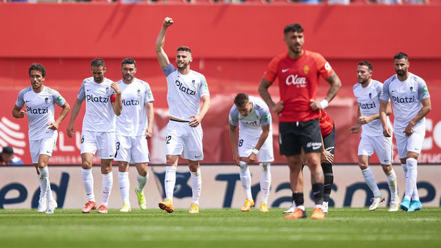 MALLORCA, SPAIN - MAY 07: Players of Granada CF celebrate after Jorge Molina scored his team sixth goal during the La Liga Santader match between RCD Mallorca and Granada CF at Estadio de Son Moix on May 07, 2022 in Mallorca, Spain.