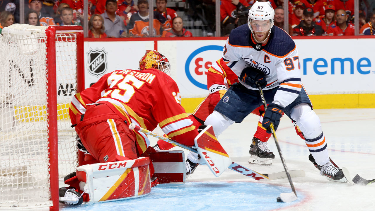 CALGARY, ALBERTA - MAY 18: Jacob Markstrom #25 of the Calgary Flames makes a save against Connor McDavid #97 of the Edmonton Oilers in Game One of the Second Round of the 2022 Stanley Cup Playoffs at Scotiabank Saddledome on May 18, 2022 in Calgary, Alberta.