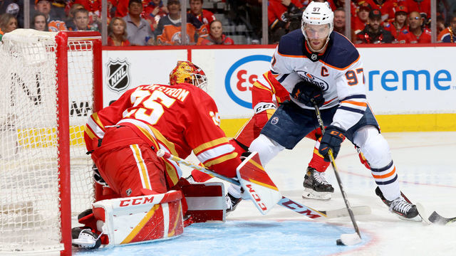 CALGARY, ALBERTA - MAY 18: Jacob Markstrom #25 of the Calgary Flames makes a save against Connor McDavid #97 of the Edmonton Oilers in Game One of the Second Round of the 2022 Stanley Cup Playoffs at Scotiabank Saddledome on May 18, 2022 in Calgary, Alberta.