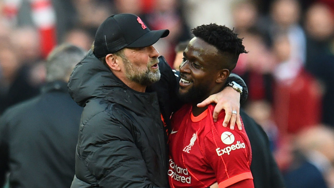LIVERPOOL, ENGLAND - APRIL 24: (THE SUN OUT,THE SUN ON SUNDAY OUT ) Jurgen Klopp manager of Liverpool with Divock Origi of Liverpool at the end of the Premier League match between Liverpool and Everton at Anfield on April 24, 2022 in Liverpool, England.
