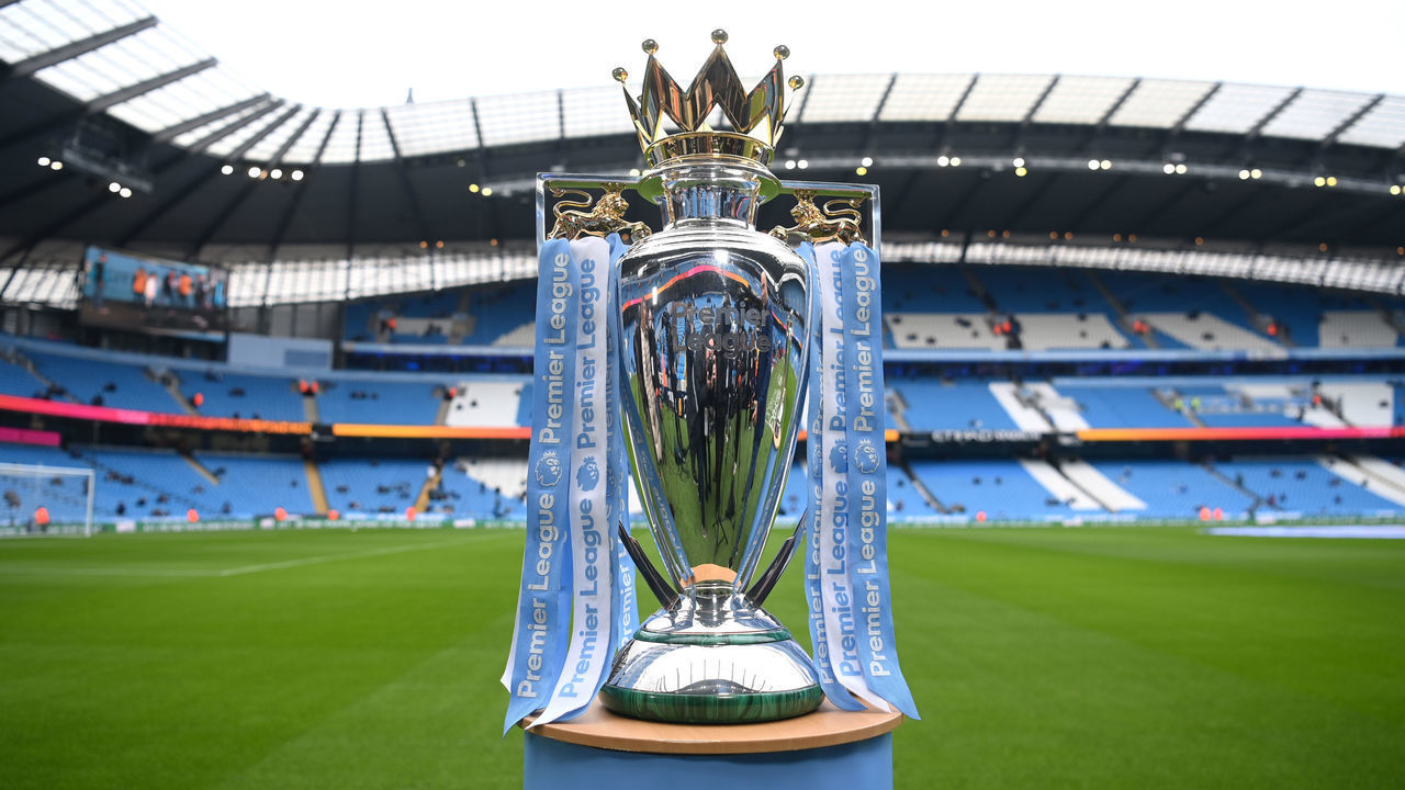 MANCHESTER, ENGLAND - JANUARY 15: A detailed view of the Premier League trophy on the pitch prior to the Premier League match between Manchester City and Chelsea at Etihad Stadium on January 15, 2022 in Manchester, England.
