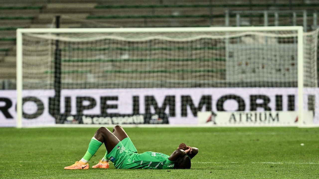 Saint-Etiennes French midfielder Lucas Gourna reacts during the French L1 football match between Saint-Etienne (ASSE) and Stade de Reims at The Geoffroy Guichard Stadium in Saint-Etienne, south-eastern France on May 14, 2022. - The match is being played behind closed doors, in an empty stadium following crowd disturbances at a previous L1 match.