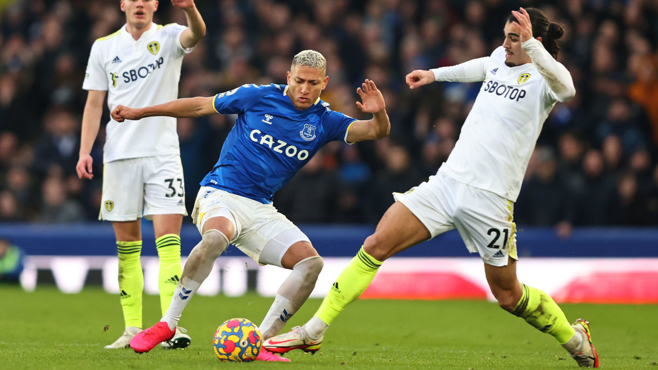 LIVERPOOL, ENGLAND - FEBRUARY 12: Richarlison of Everton in action with Pascal Struijk of Leeds United during the Premier League match between Everton and Leeds United at Goodison Park on February 12, 2022 in Liverpool, United Kingdom.