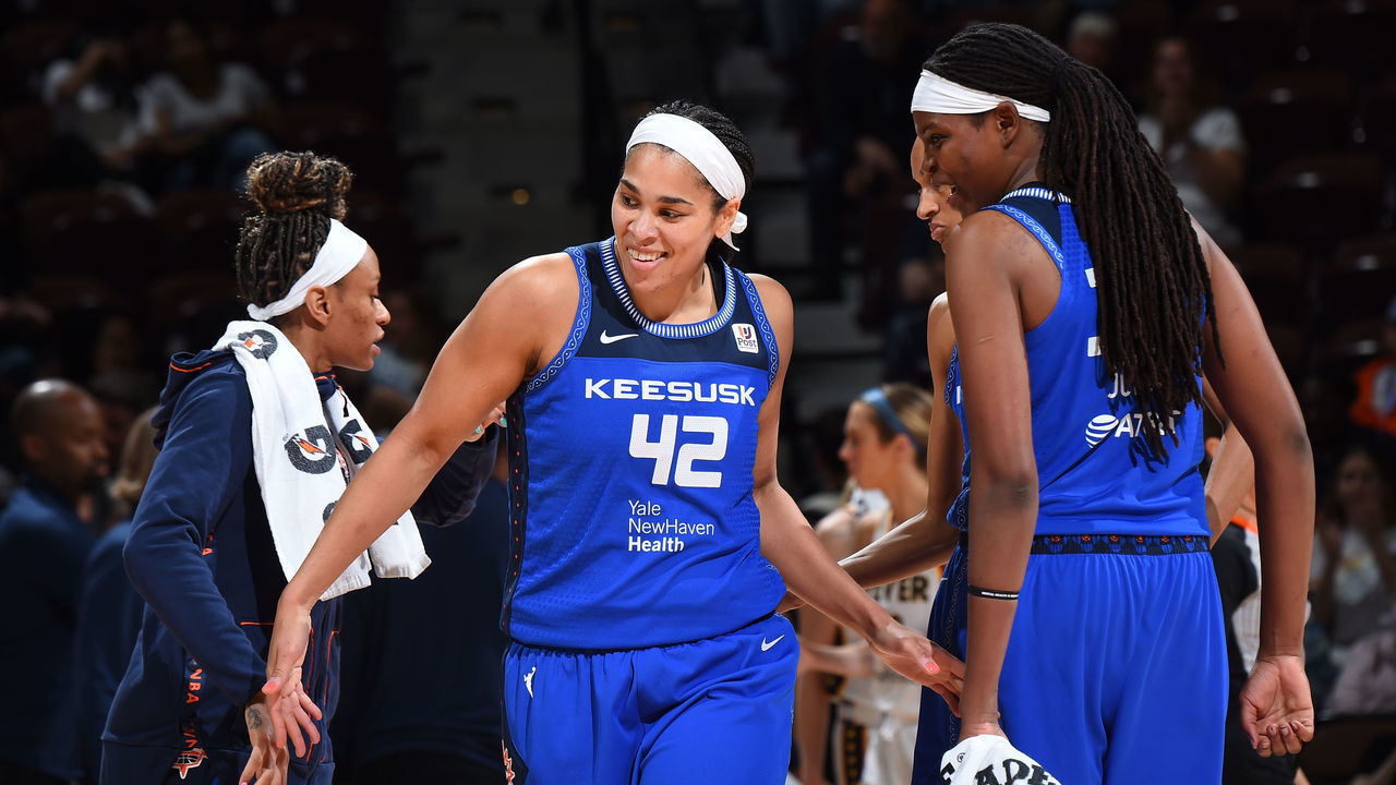 UNCASVILLE, CT - MAY 20: Brionna Jones #42 of the Connecticut Sun high fives Jonquel Jones #35 of the Connecticut Sun during the game against the Indiana Fever on May 20, 2022 at the Mohegan Sun Arena in Uncasville, Connecticut. Mandatory Copyright Notice: Copyright 2022 NBAE