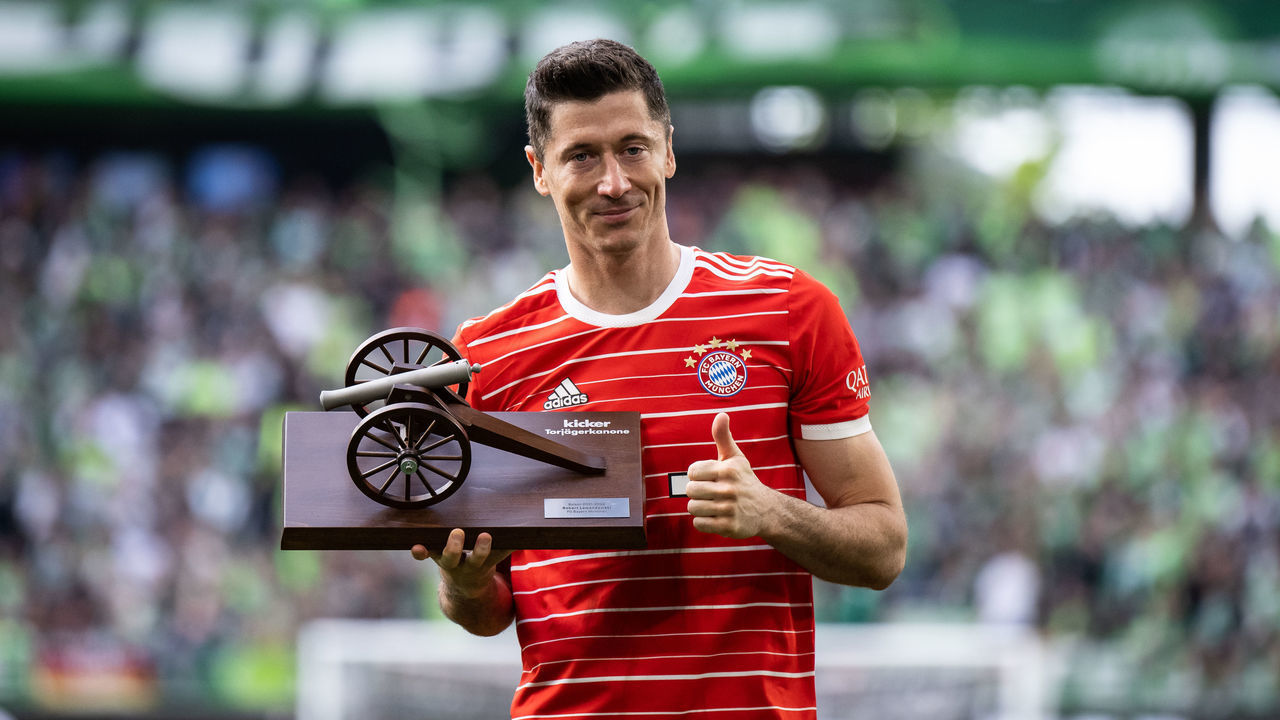WOLFSBURG, GERMANY - MAY 14: Robert Lewandowski of Munich is being honored as top scorer of the season 2021-22 after the Bundesliga match between VfL Wolfsburg and FC Bayern München at Volkswagen Arena on May 14, 2022 in Wolfsburg, Germany.