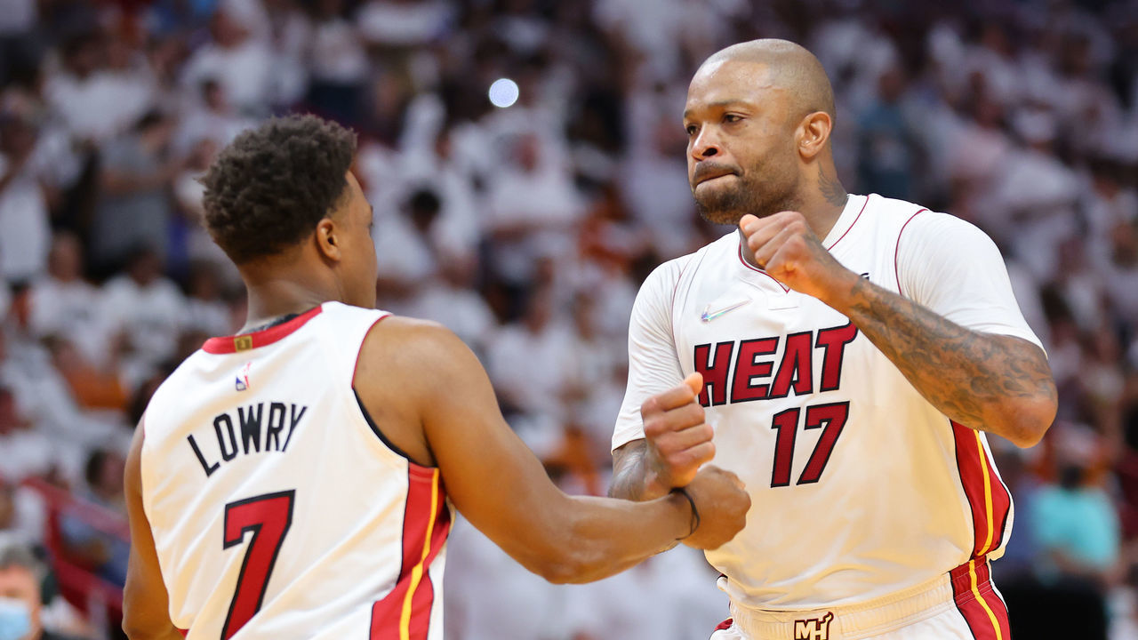 MIAMI, FLORIDA - APRIL 17: Kyle Lowry #7 and P.J. Tucker #17 of the Miami Heat react prior to Game One of the Eastern Conference First Round against the Atlanta Hawks at FTX Arena on April 17, 2022 in Miami, Florida.