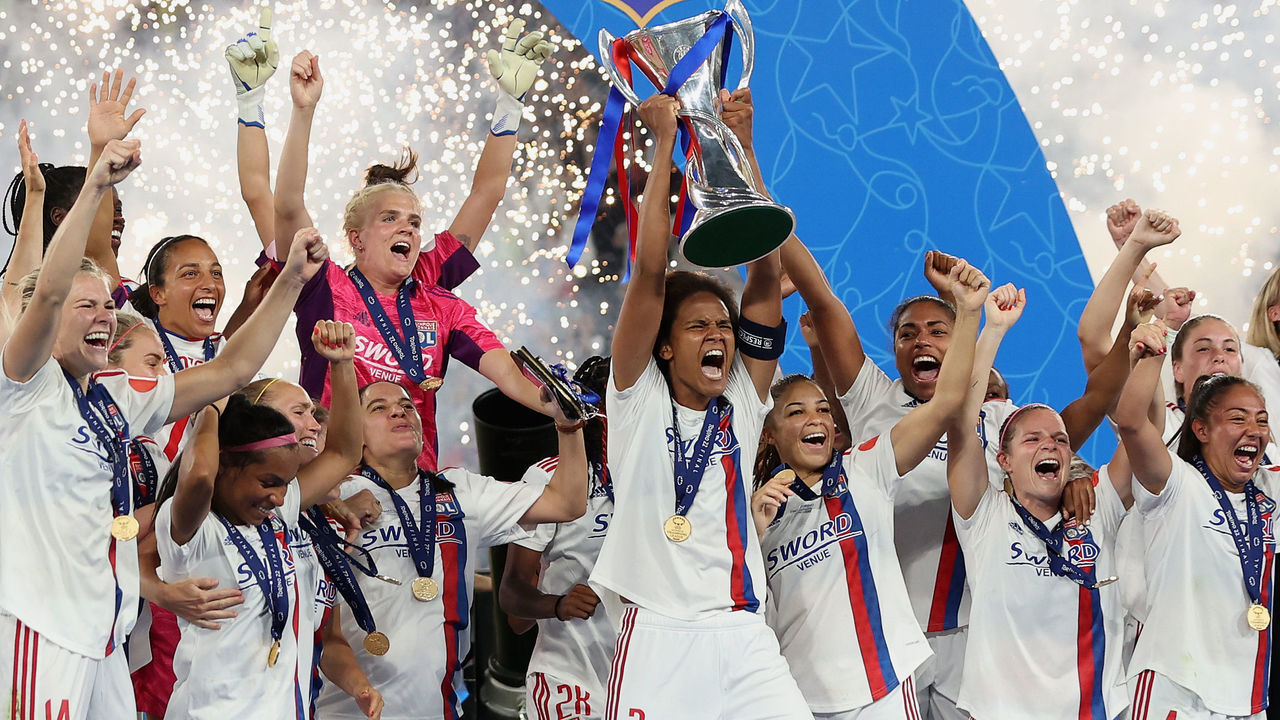 TURIN, ITALY - MAY 21: Wendie Renard of Olympique Lyonnais lifts the UEFA Women's Champions League following victory in the UEFA Women's Champions League final match between FC Barcelona and Olympique Lyonnais at Juventus Stadium on May 21, 2022 in Turin, Italy.