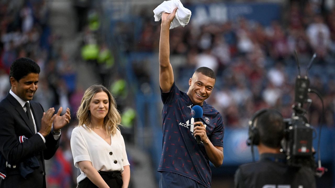 Paris Saint-Germain's French forward Kylian Mbappe addresses supporters after the announcement he staying at PSG until 2025 before the French L1 football match between Paris Saint-Germain (PSG) and Metz at the Parc des Princes stadium in Paris on May 21, 2022.