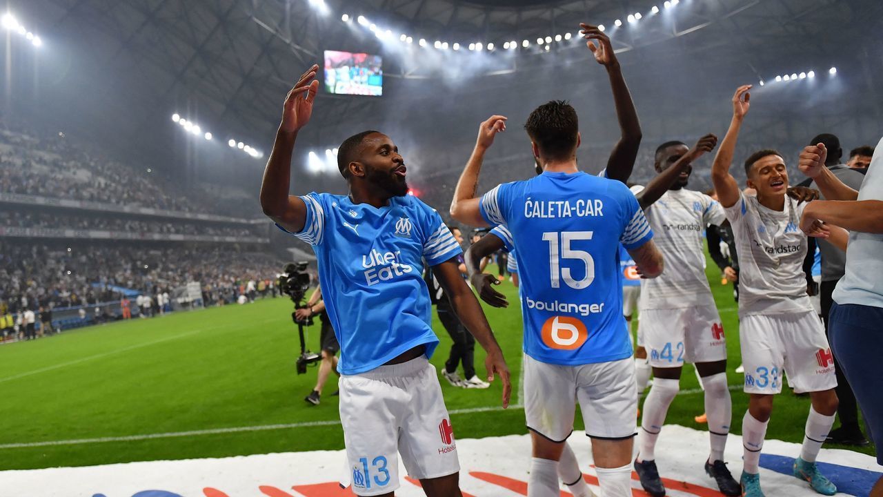 Marseille's players react at the end of the French L1 football match between Olympique Marseille (OM) and RC Strasbourg Alsace at Stade Velodrome in Marseille, southern France on May 21, 2022.
