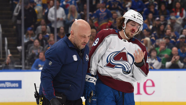 ST. LOUIS, MO - May 21: Samuel Girard #49 of the Colorado Avalanche leaves the ice with training staff after being injured in the game against the St. Louis Blues in Game Three of the Second Round of the 2022 Stanley Cup Playoffs at the Enterprise Center on May 21, 2022 in St. Louis, Missouri.