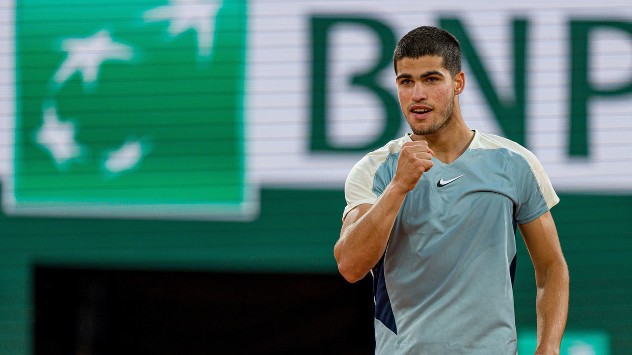 PARIS, FRANCE - MAY 22: Carlos Alcaraz of Spain celebrates winning match point during the Men's Singles First Round match against Juan Ignacio Londero of Argentina on Day 1 of The 2022 French Open at Roland Garros in Paris, France.