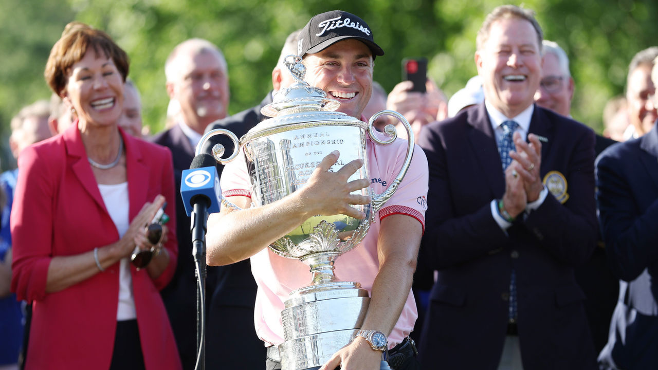 TULSA, OKLAHOMA - MAY 22: Justin Thomas of the United States celebrates with the Wanamaker Trophy after putting in to win on the 18th green, the third playoff hole during the final round of the 2022 PGA Championship at Southern Hills Country Club on May 22, 2022 in Tulsa, Oklahoma.