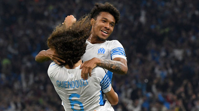 Marseille's French defender Boubacar Kamara (R) celebrates scoring his team's first goal with Marseille's French defender Matteo Guendouzi (L) during the French L1 football match between Olympique de Marseille (OM) and FC Lorient at Stade Velodrome in Marseille, southern France on October 17, 2021.