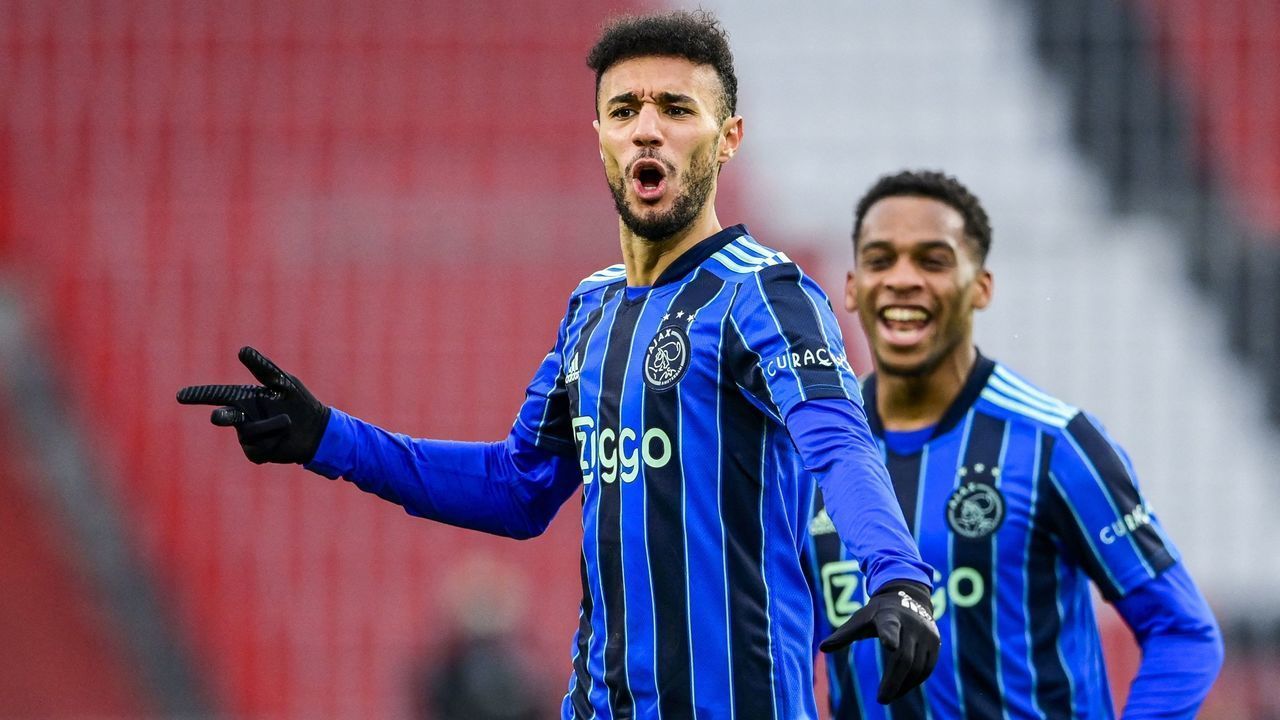 Ajax's Moroccan defender Noussair Mazraoui celebrates a goal during the Dutch Eredivisie match between PSV Eindhoven and Ajax Amsterdam at Phillips Stadium in Eindhoven on January 23, 2022. - - Netherlands OUT
