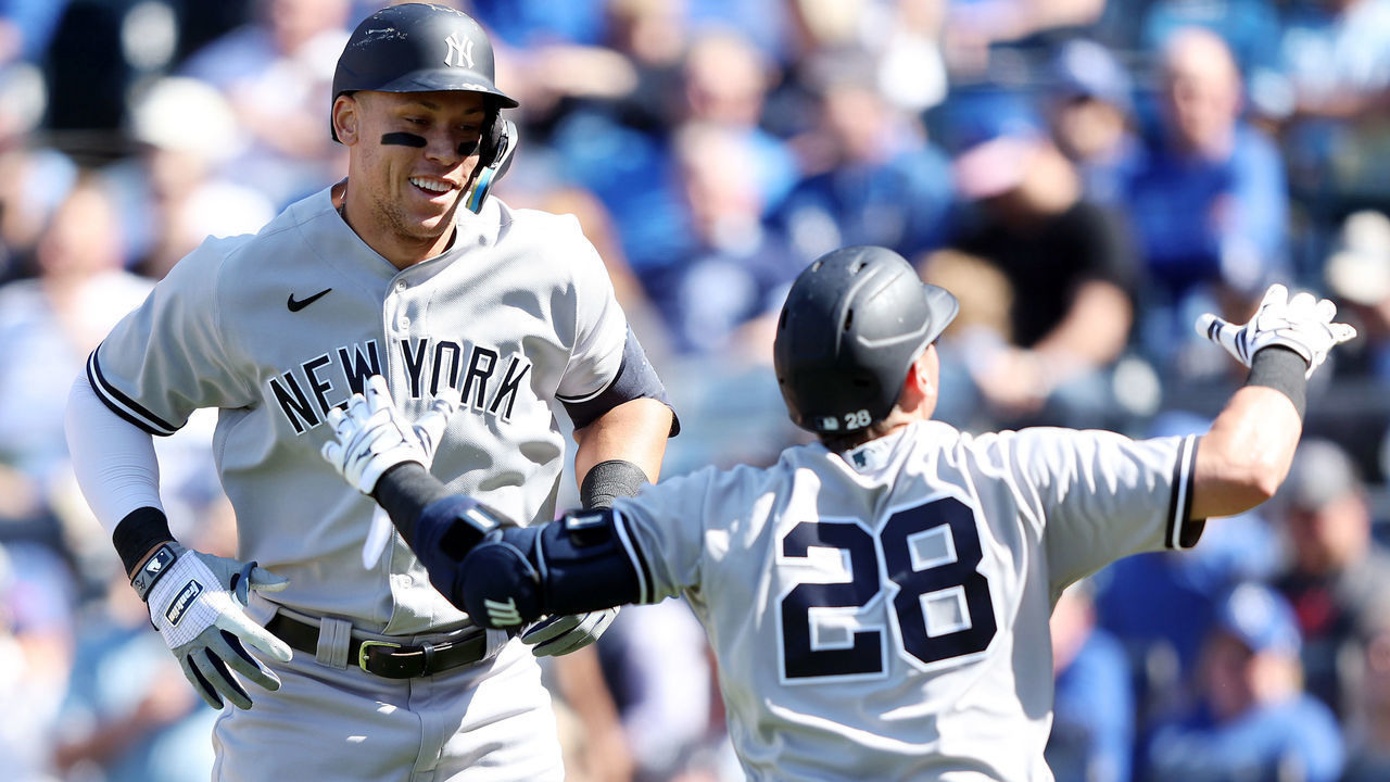 KANSAS CITY, MISSOURI - MAY 01: Aaron Judge #99 of the New York Yankees is congratulated by Josh Donaldson #28 after hitting a solo home run during the 9th inning of the game against the Kansas City Royals at Kauffman Stadium on May 01, 2022 in Kansas City, Missouri.