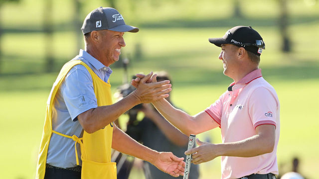 TULSA, OKLAHOMA - MAY 22: Justin Thomas of the United States reacts to his winning putt on the 18th hole with caddie Jim "Bones" Mackay, the third playoff hole during the final round of the 2022 PGA Championship at Southern Hills Country Club on May 22, 2022 in Tulsa, Oklahoma.