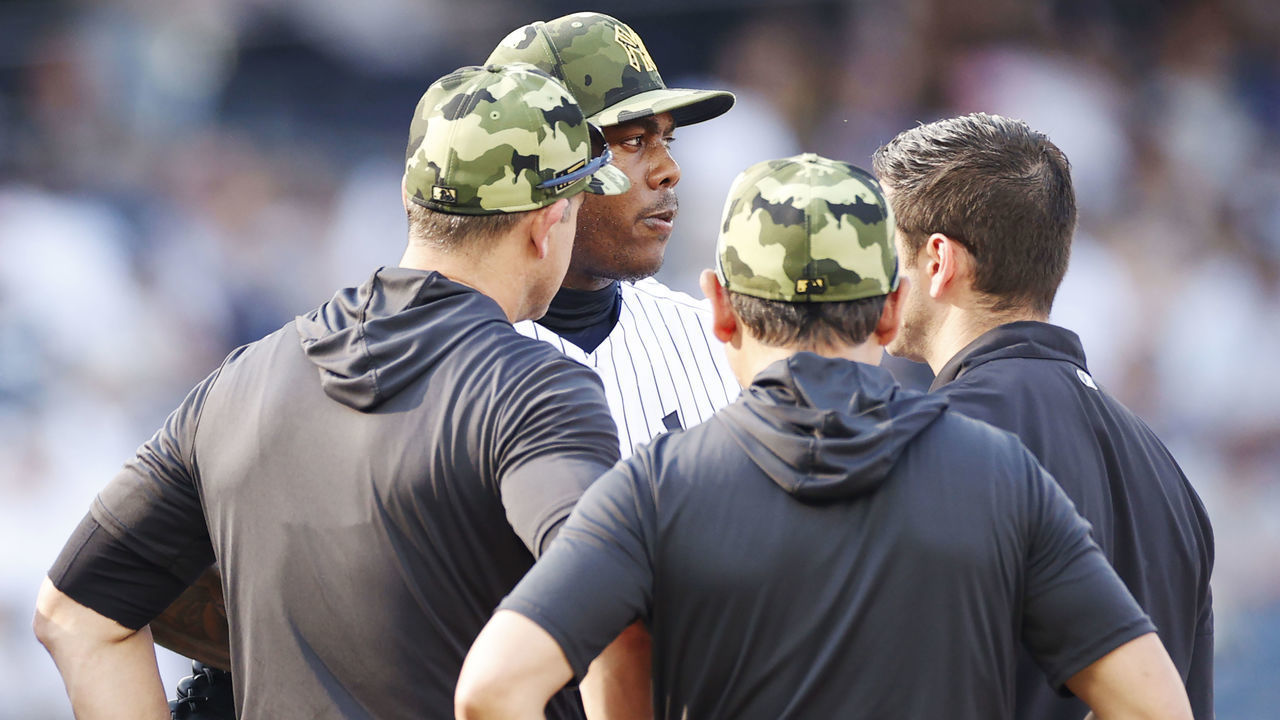 NEW YORK, NEW YORK - MAY 22: Aroldis Chapman #54 of the New York Yankees talks with coaches on the mound during the ninth inning of Game One of a doubleheader against the Chicago White Sox at Yankee Stadium on May 22, 2022 in the Bronx borough of New York City. The White Sox won 3-1.