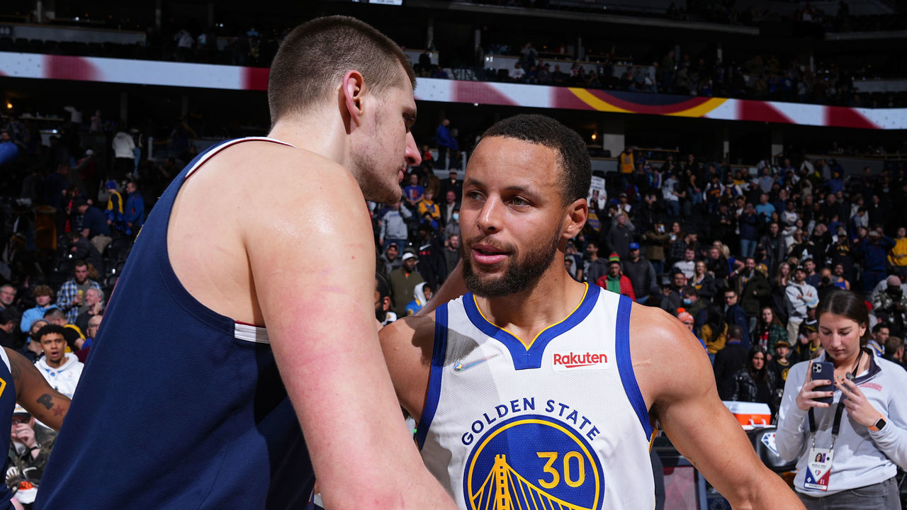 DENVER, CO - MARCH 10: Nikola Jokic #15 of the Denver Nuggets and Stephen Curry #30 of the Golden State Warriors embrace after the game on March 10, 2022 at the Ball Arena in Denver, Colorado. NOTE TO USER: User expressly acknowledges and agrees that, by downloading and/or using this Photograph, user is consenting to the terms and conditions of the Getty Images License Agreement. Mandatory Copyright Notice: Copyright 2022 NBAE