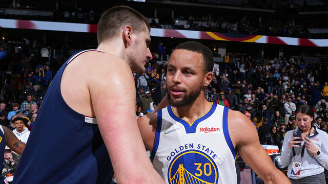 DENVER, CO - MARCH 10: Nikola Jokic #15 of the Denver Nuggets and Stephen Curry #30 of the Golden State Warriors embrace after the game on March 10, 2022 at the Ball Arena in Denver, Colorado. NOTE TO USER: User expressly acknowledges and agrees that, by downloading and/or using this Photograph, user is consenting to the terms and conditions of the Getty Images License Agreement. Mandatory Copyright Notice: Copyright 2022 NBAE