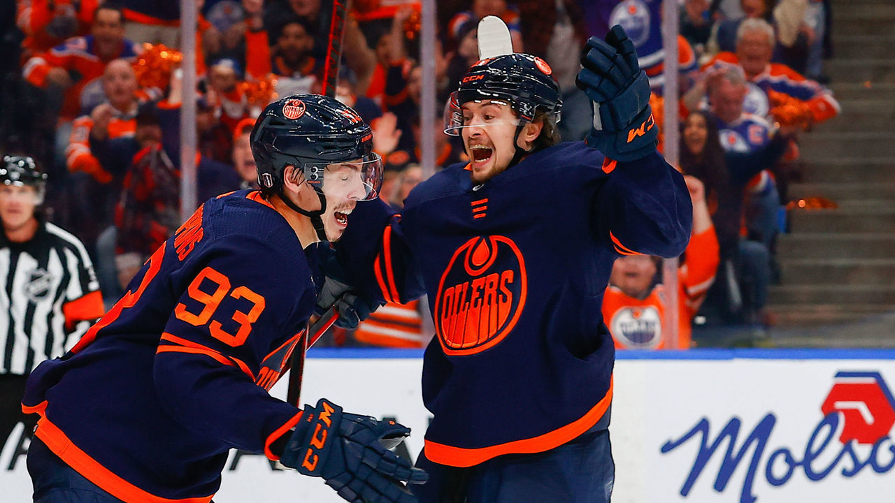 EDMONTON, AB - MAY 24: Edmonton Oilers Center Ryan Nugent-Hopkins (93) celebrates his goal with Edmonton Oilers Right Wing Kailer Yamamoto (56) in the third period during the Edmonton Oilers versus the Calgary Flames in the Stanley Cup playoffs round 2, game 4 on May 24, 2022 at Rogers Place in Edmonton, AB.