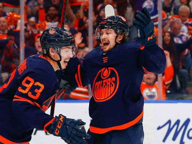 EDMONTON, AB - MAY 24: Edmonton Oilers Center Ryan Nugent-Hopkins (93) celebrates his goal with Edmonton Oilers Right Wing Kailer Yamamoto (56) in the third period during the Edmonton Oilers versus the Calgary Flames in the Stanley Cup playoffs round 2, game 4 on May 24, 2022 at Rogers Place in Edmonton, AB.