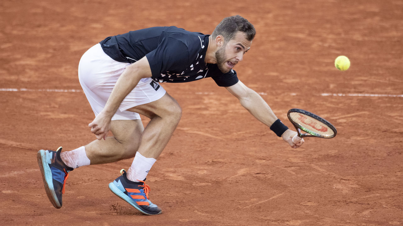 PARIS, FRANCE May 24. Hugo Gaston of France in action against Alex de Minaur of Australia on Court Suzanne Lenglen during the singles first round match at the 2022 French Open Tennis Tournament at Roland Garros on May 24th 2022 in Paris, France.