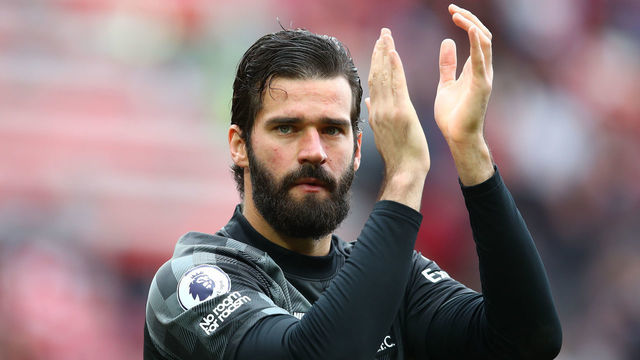 LIVERPOOL, ENGLAND - MAY 22: Alisson of Liverpool applauds the supporters at full-time following the Premier League match between Liverpool and Wolverhampton Wanderers at Anfield on May 22, 2022 in Liverpool, England.