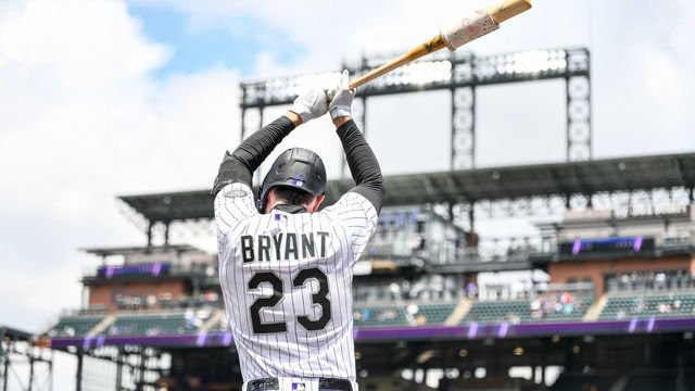 DENVER, CO - May 21: Colorado Rockies outfielder Kris Bryant (23) warms up before batting during game 1 of a doubleheader between the New York Mets and the Colorado Rockies at Coors Field on May 21, 2022 in Denver, Colorado.