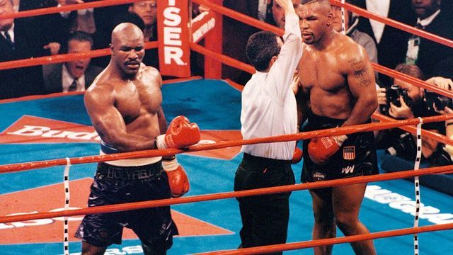 LAS VEGAS - NOVEMBER 9,1996: Mike Tyson (R) is pulled away during the fight against Evander Holyfield at the MGM Grand, on November 9,1996 in Las Vegas, Nevada. Evander Holyfield won by a TKO 11. (Photo by: The Ring Magazine via Getty Images)