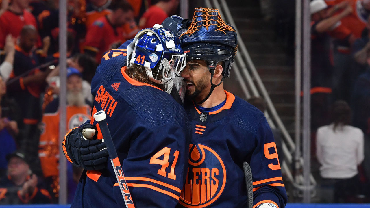 EDMONTON, AB - MAY 24: Mike Smith #41 and Evander Kane #91 of the Edmonton Oilers celebrate after winning Game Four of the Second Round of the 2022 Stanley Cup Playoffs against the Calgary Flames on May 24, 2022 at Rogers Place in Edmonton, Alberta, Canada.