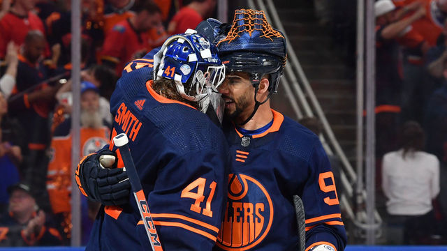 EDMONTON, AB - MAY 24: Mike Smith #41 and Evander Kane #91 of the Edmonton Oilers celebrate after winning Game Four of the Second Round of the 2022 Stanley Cup Playoffs against the Calgary Flames on May 24, 2022 at Rogers Place in Edmonton, Alberta, Canada.