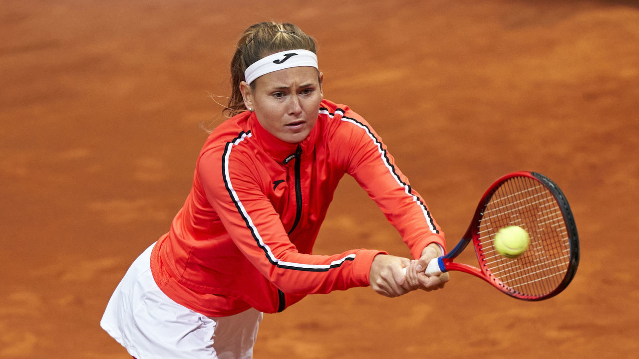 MADRID, SPAIN - MAY 02: Marie Bouzkova of Czech Republic returns a ball to Ekaterina Alexandrova of Russia during their Women's Singles match on Day Five of the Mutua Madrid Open at La Caja Magica on May 02, 2022 in Madrid, Spain.