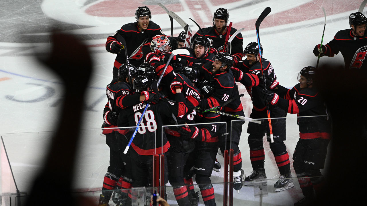 RALEIGH, NC - MAY 18: Members of the Carolina Hurricanes celebrate winning game 1 of the second round of the Stanley Cup Playoffs between the New York Rangers and the Carolina Hurricanes on May 18, 2022 at PNC Arena in Raleigh, North Carolina.