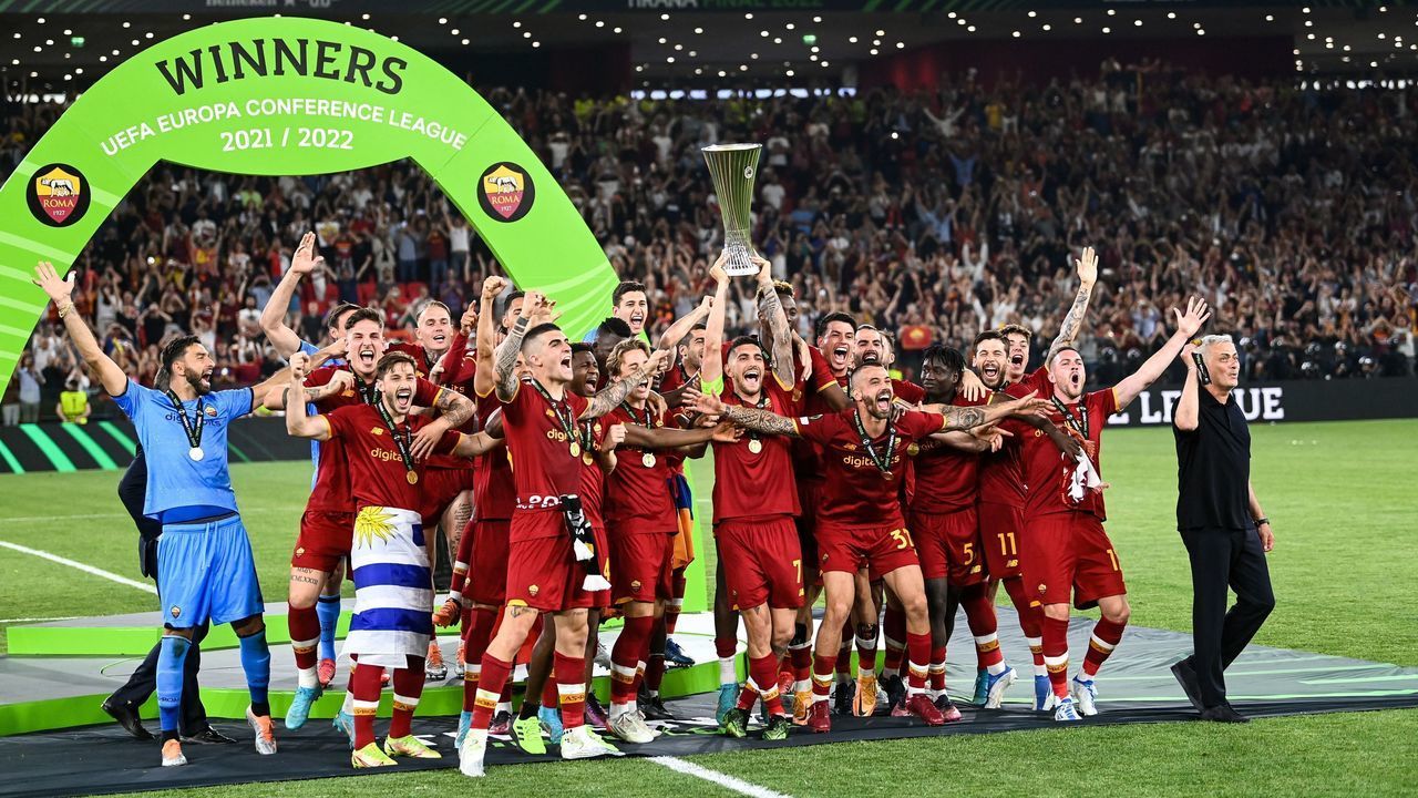 Roma's Italian midfielder and captain Lorenzo Pellegrini lifts the trophy as Roma's players celebrate after winning the UEFA Europa Conference League final football match between AS Roma and Feyenoord at the Air Albania Stadium in Tirana on May 25, 2022.