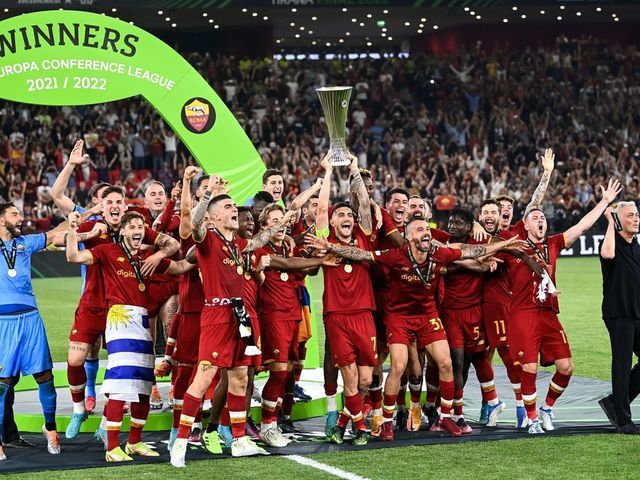 Roma's Italian midfielder and captain Lorenzo Pellegrini lifts the trophy as Roma's players celebrate after winning the UEFA Europa Conference League final football match between AS Roma and Feyenoord at the Air Albania Stadium in Tirana on May 25, 2022.