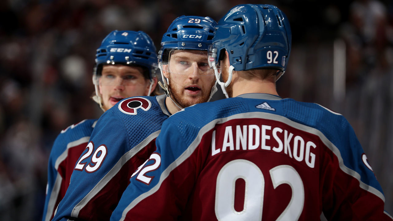 DENVER, COLORADO - MAY 25: Bowen Byram #4, Nathan MacKinnon #29 and Gabriel Landeskog #92 of the Colorado Avalanche look on during a pause in play against the St. Louis Blues in Game Five of the Second Round of the 2022 Stanley Cup Playoffs at Ball Arena on May 25, 2022 in Denver, Colorado.