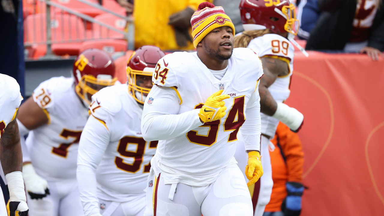 DENVER, CO - OCTOBER 31: Daron Payne #94 of the Washington Football Team runs out to the field before the game against the Denver Broncos at Empower Field At Mile High on October 31, 2021 in Denver, Colorado.
