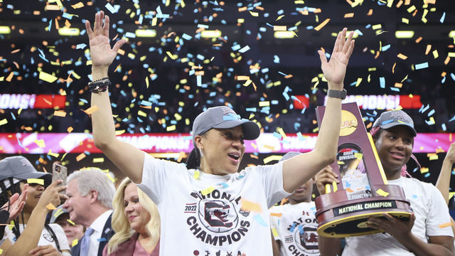 MINNEAPOLIS, MN - APRIL 03: Head coach Dawn Staley of the South Carolina Gamecocks celebrates as Aliyah Boston #4 of the South Carolina Gamecocks raises the trophy after defeating the UConn Huskies during the championship game of the NCAA Women’s Basketball Tournament at Target Center on April 3, 2022 in Minneapolis, Minnesota.