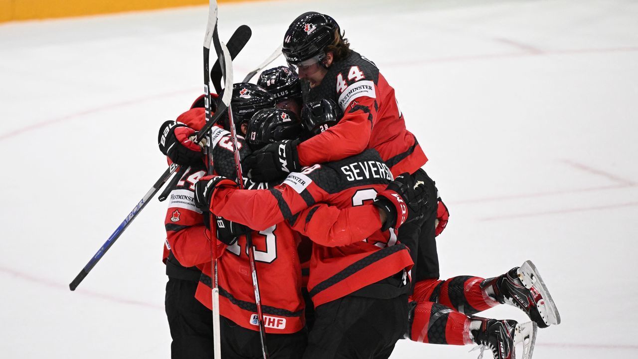 Canada's players celebrate after Canada's forward Matt Barzal scored the 3-3 goal during the IIHF Ice Hockey World Championships quarterfinal match between Sweden and Canada in Tampere, Finland, on May 26, 2022.
