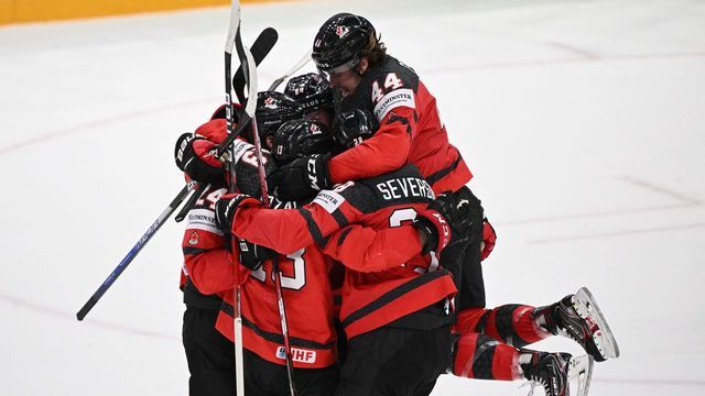 Canada's players celebrate after Canada's forward Matt Barzal scored the 3-3 goal during the IIHF Ice Hockey World Championships quarterfinal match between Sweden and Canada in Tampere, Finland, on May 26, 2022.