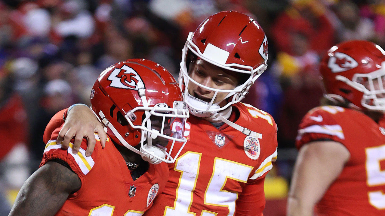 KANSAS CITY, MISSOURI - JANUARY 23: Tyreek Hill #10 of the Kansas City Chiefs celebrates with teammate Patrick Mahomes #15 after scoring a 64 yard touchdown against the Buffalo Bills during the fourth quarter in the AFC Divisional Playoff game at Arrowhead Stadium on January 23, 2022 in Kansas City, Missouri.
