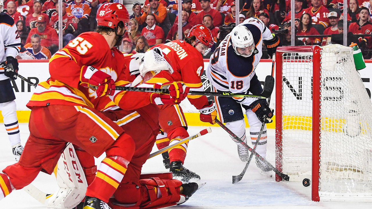 CALGARY, AB - MAY 26: Zach Hyman #18 of the Edmonton Oilers scores on Jacob Markstrom #25 of the Calgary Flames during the second period of Game Five of the Second Round of the 2022 Stanley Cup Playoffs at Scotiabank Saddledome on May 26, 2022 in Calgary, Alberta, Canada.