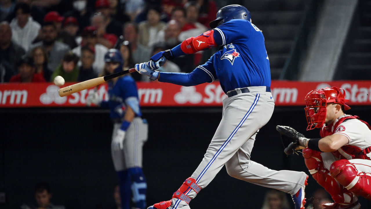 ANAHEIM, CA - MAY 26: Toronto Blue Jays designated hitter Vladimir Guerrero Jr. (27) hits a solo home run in the sixth inning of an MLB baseball game against the Los Angeles Angels played on May 26, 2022 at Angel Stadium in Anaheim, CA.