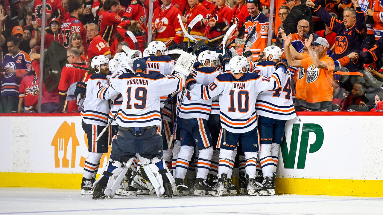 CALGARY, AB - MAY 26: Edmonton Oilers Center Connor McDavid (97) and teammates celebrate his series winning goal against the Calgary Flames during the first overtime period of game 5 of the second round of the NHL Stanley Cup Playoffs on May 26, 2022, at the Scotiabank Saddledome in Calgary, AB.